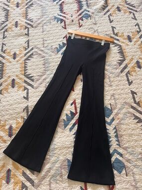 DONNI. Black Wide-Leg Flared Knit Pants